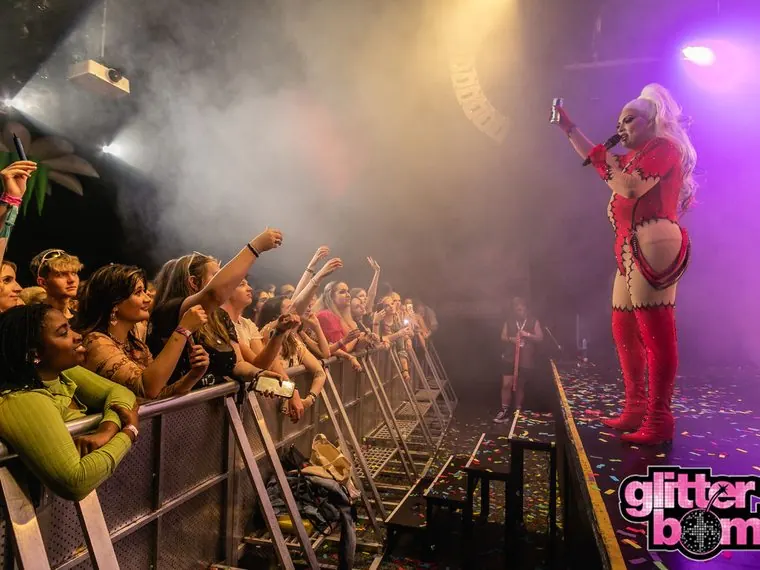 A Glitterbomb performer with the crowd at the barrier