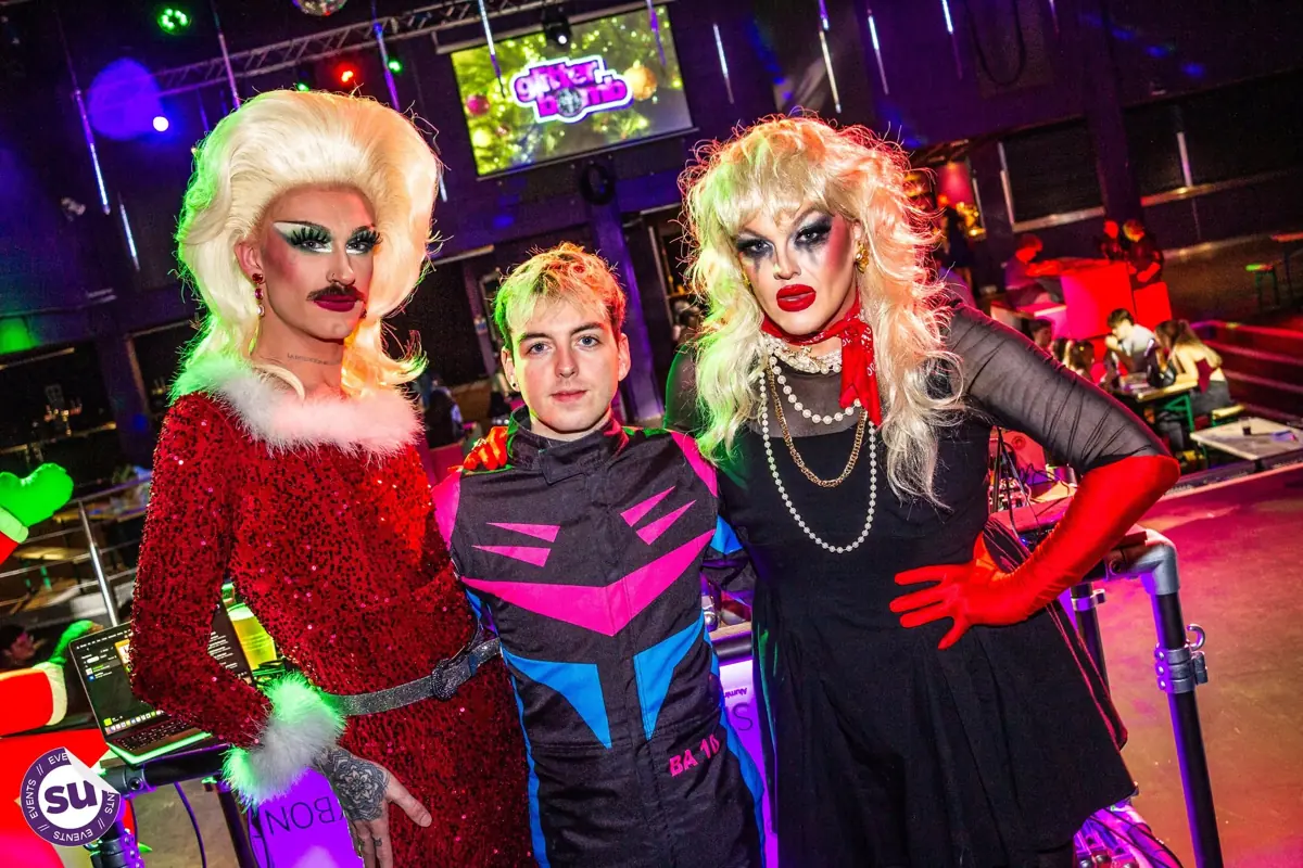 Two drag queens with the crowd at a Glitterbomb night